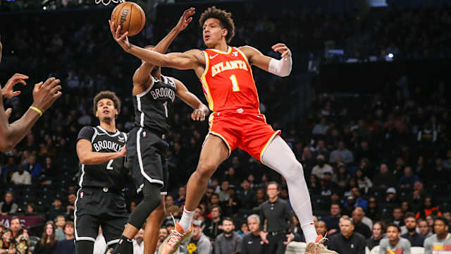 Mar 2, 2024; Brooklyn, New York, USA; Atlanta Hawks forward Jalen Johnson (1) drives past Brooklyn Nets forward Mikal Bridges (1) in the first quarter at Barclays Center. Mandatory Credit: Wendell Cruz-USA TODAY Sports